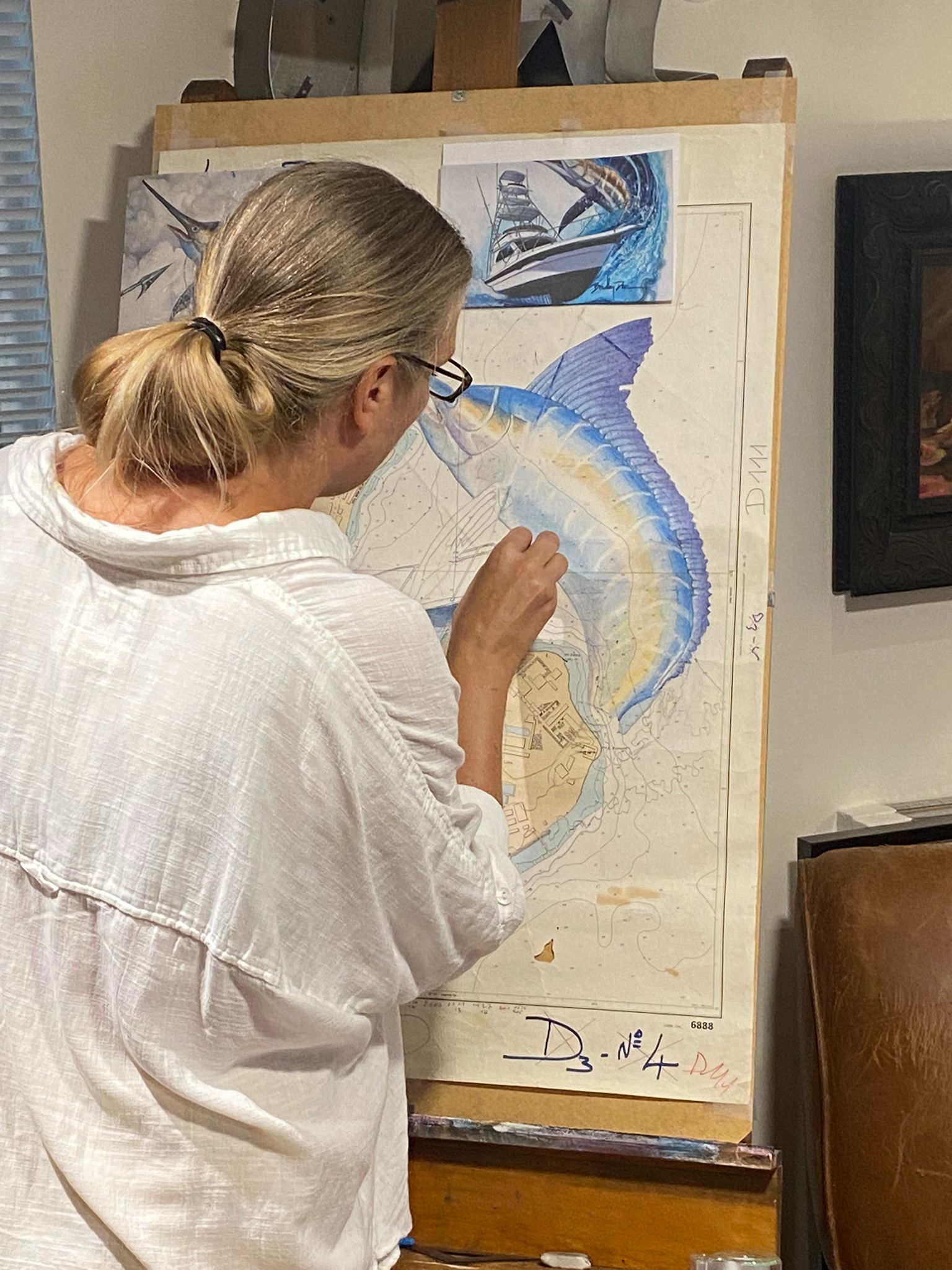 Essebes adding color to blue marlin chart artwork