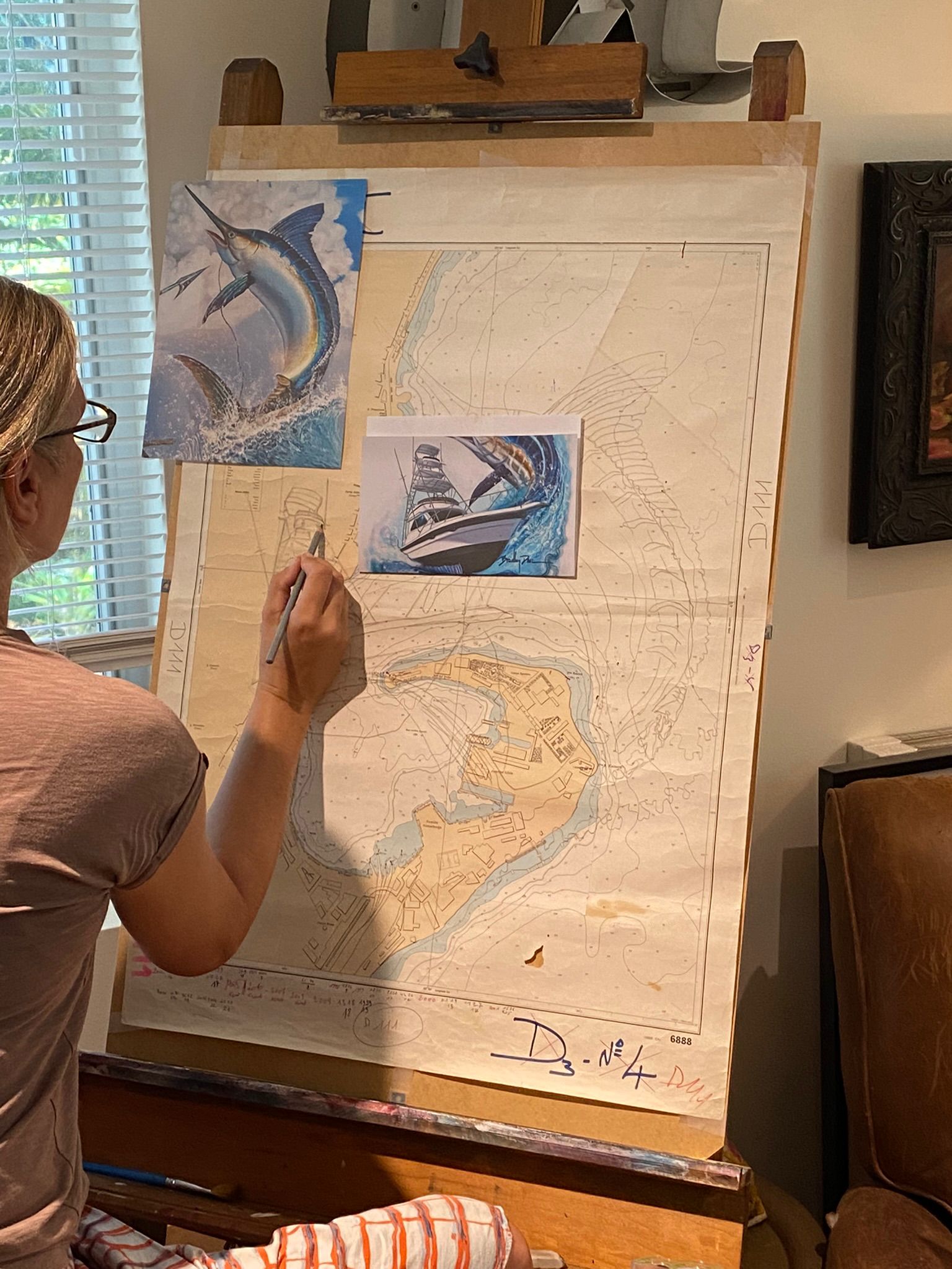 Essebes sketching marlin and sportfisher on nautical chart