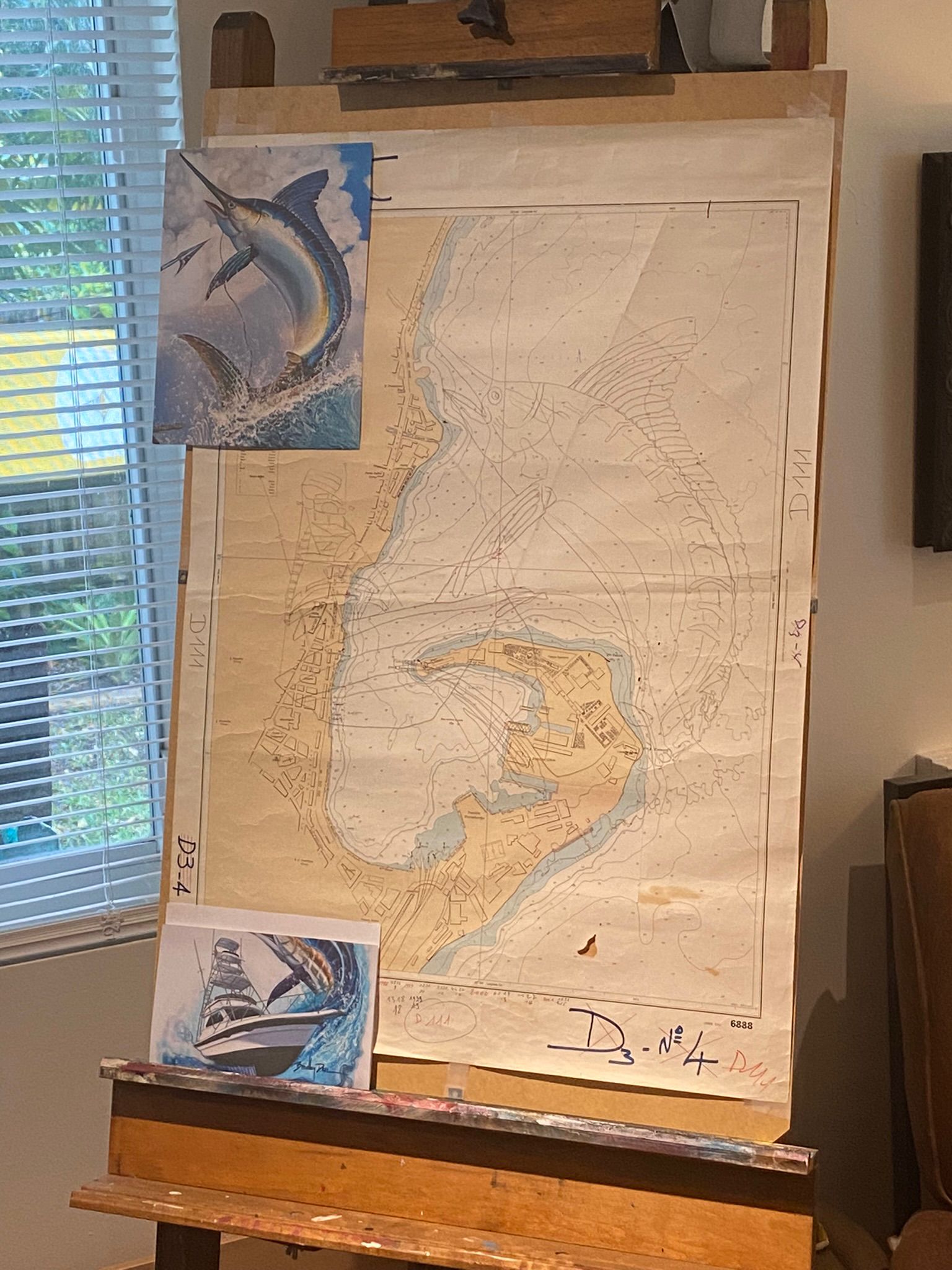 Reference photos taped above nautical chart